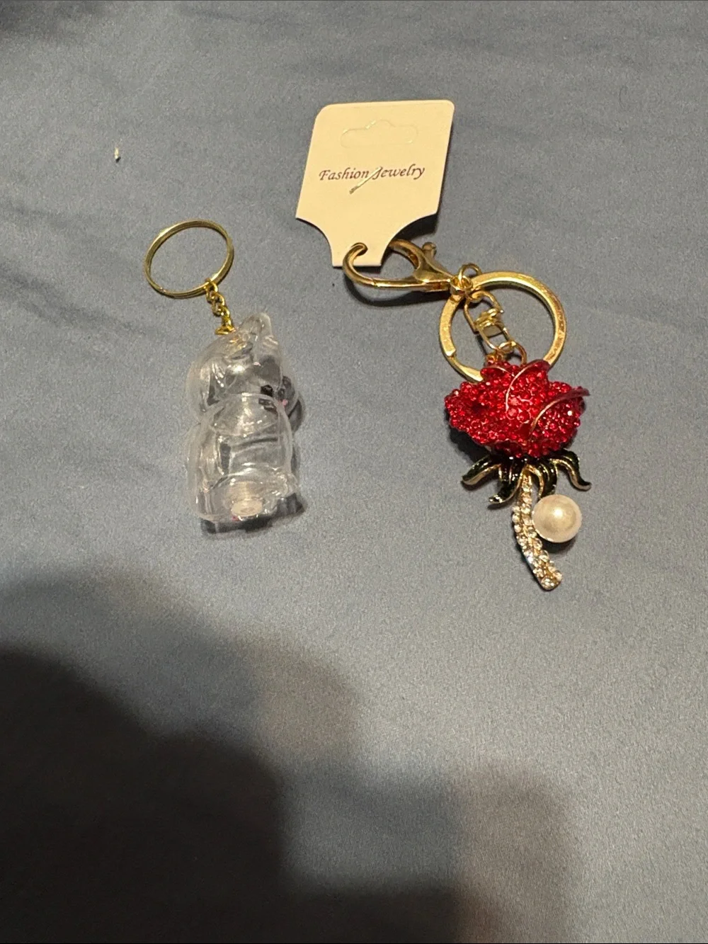 Red Rose Crystal Keychain with Gold Hardware and cat clear keychain.